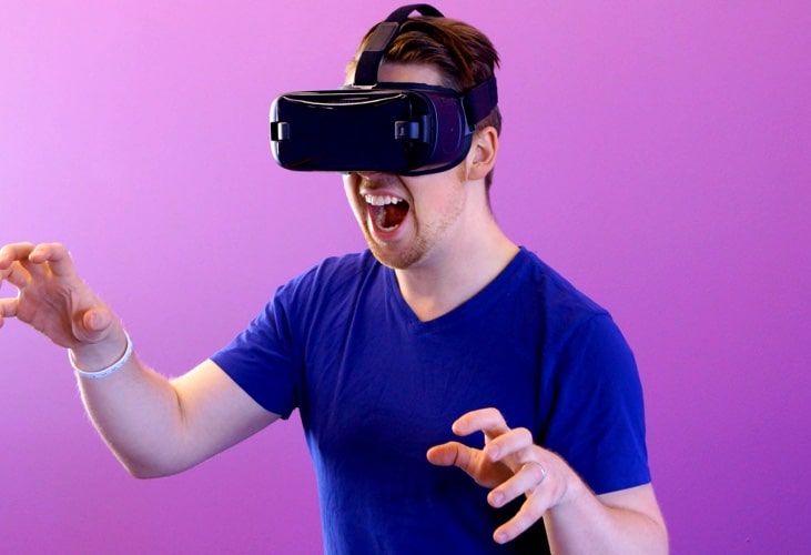 a person interacting with a virtual reality glasses